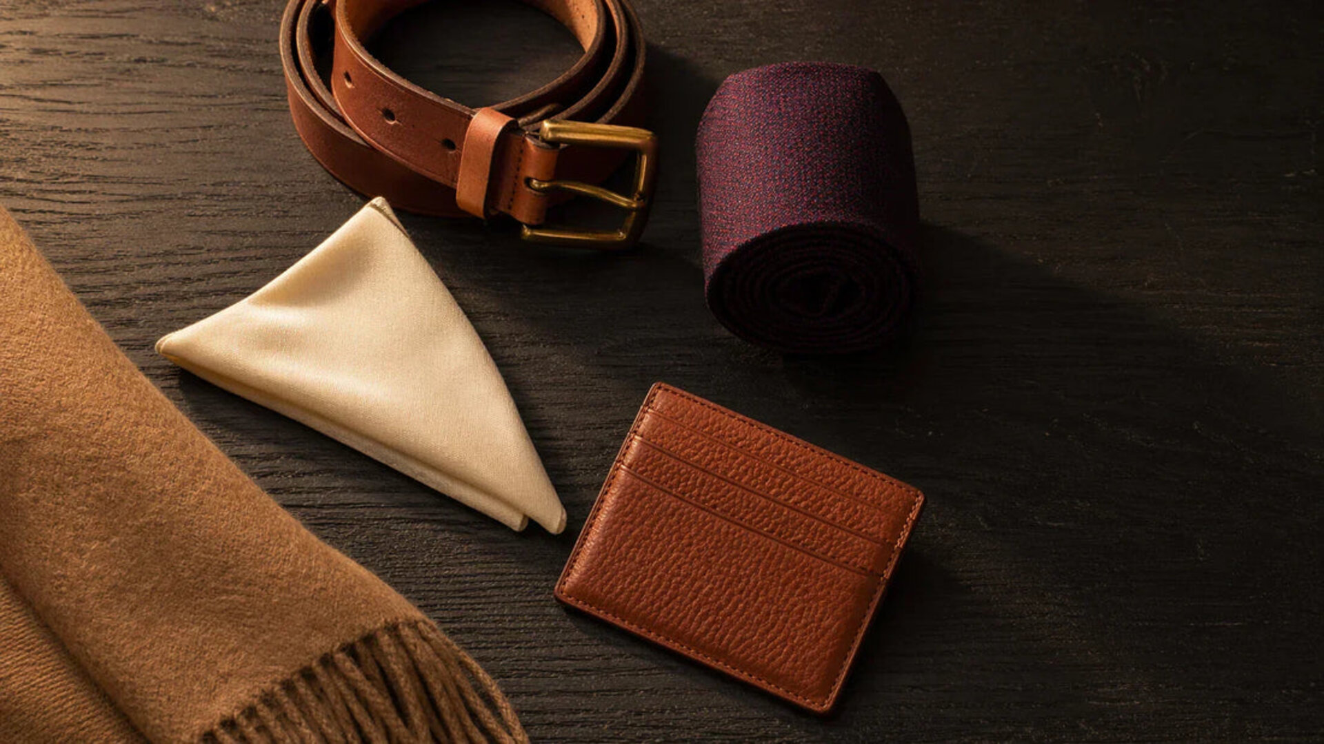 Premium gentleman accessories on dark desk